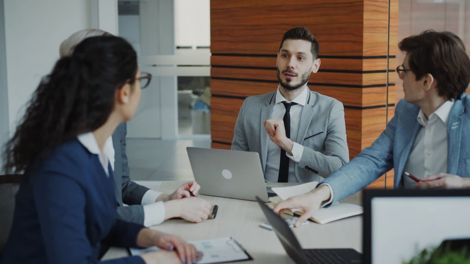 Business team reviewing a project on a laptop
