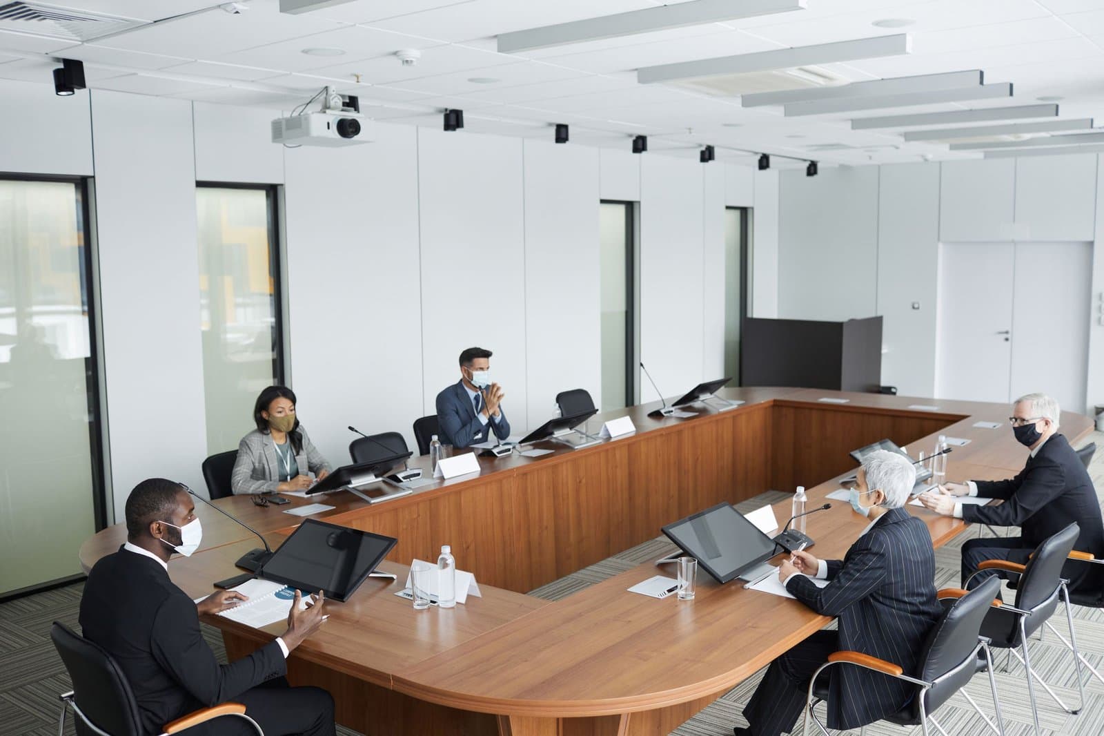 Boardroom-style conference session in progress