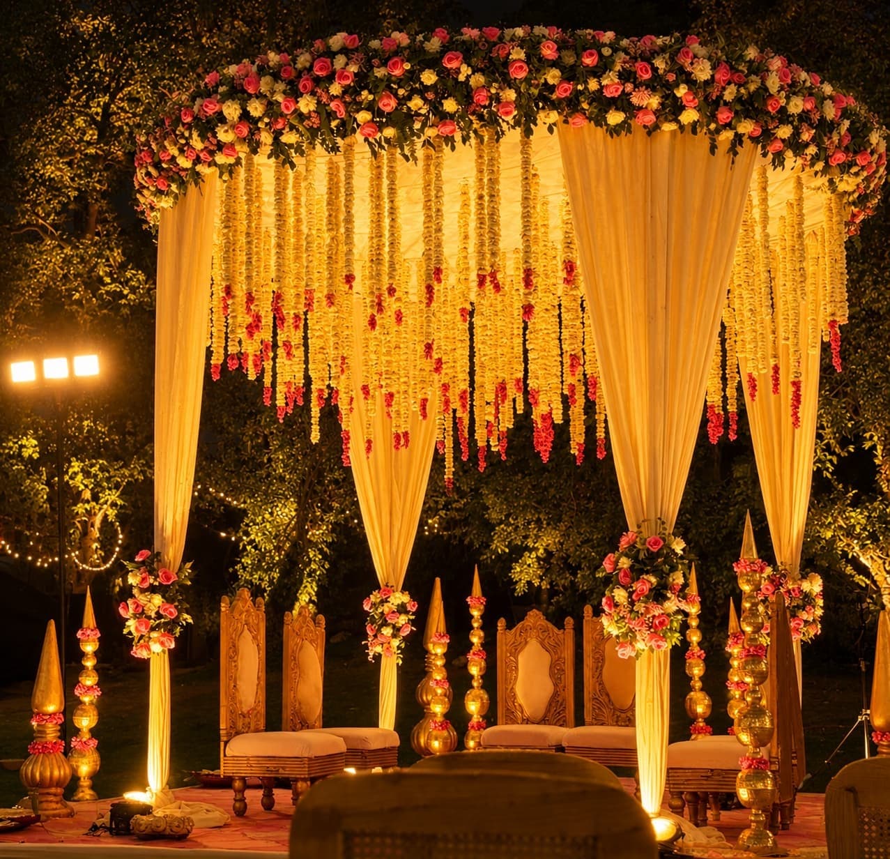 Marigold and rose mandap ceremony stage at dusk