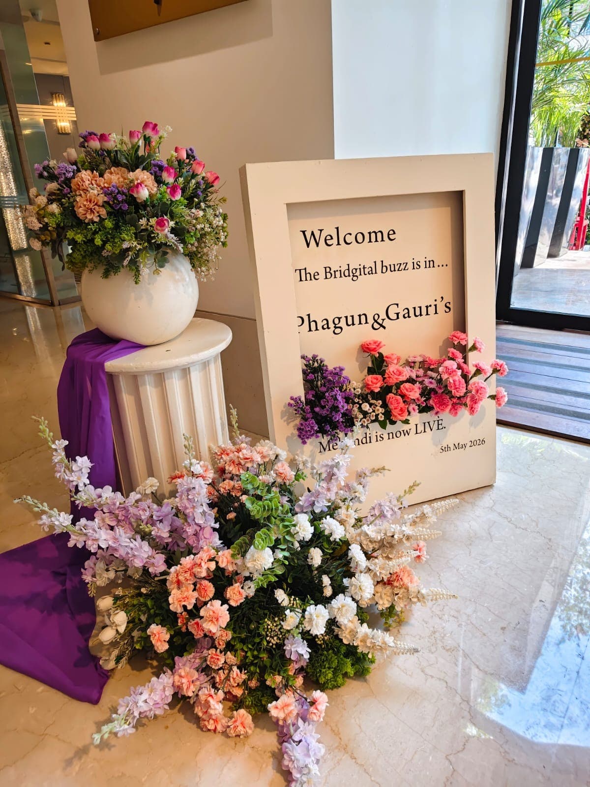 Lavender-themed poolside reception with sheer draping