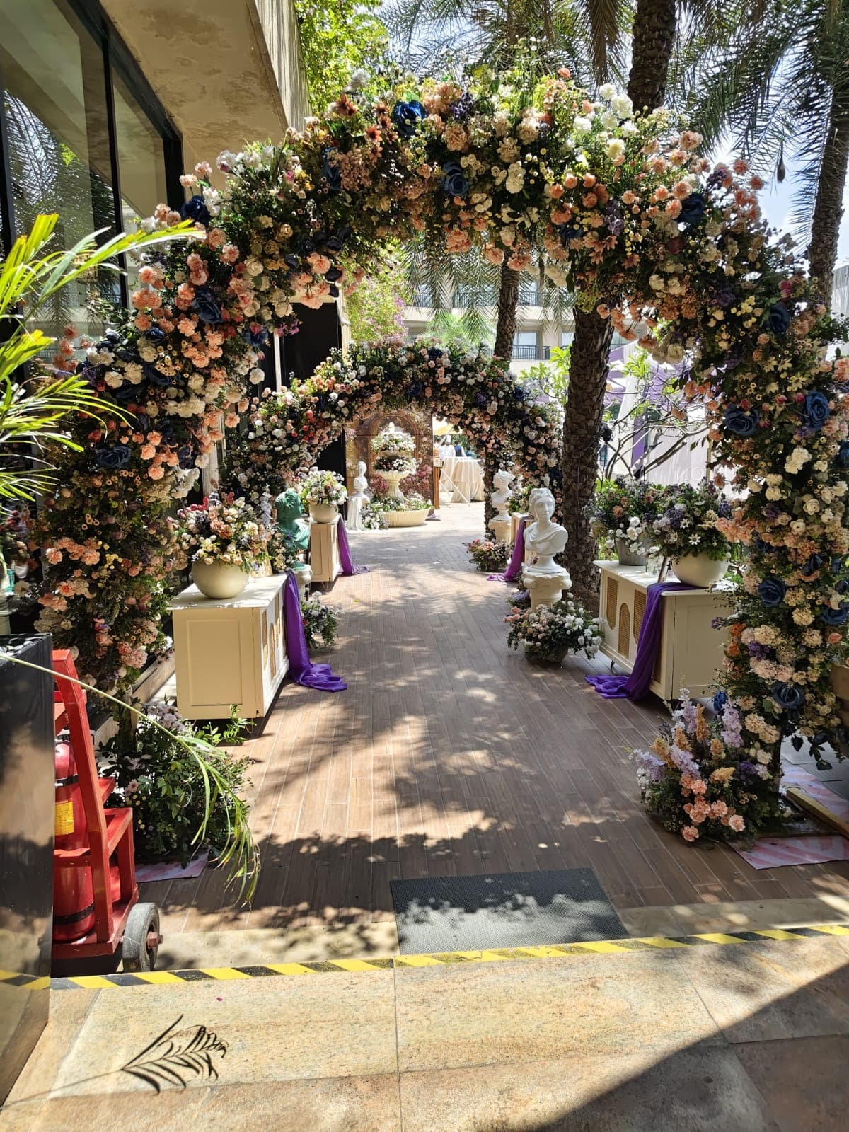 Floral archway detail with blue and blush blooms