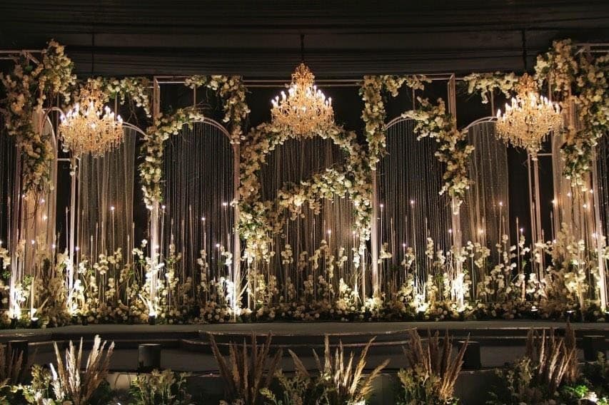 Fairy-light curtain mandap with hanging candelabras