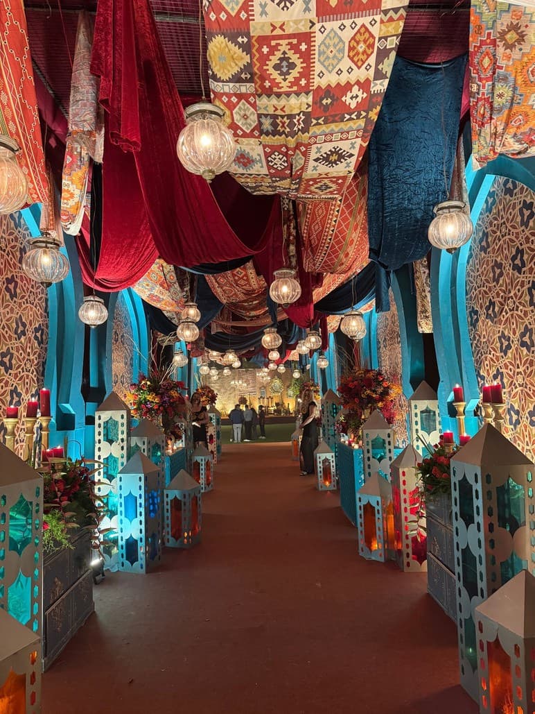 Jewel-toned lantern-lit hallway with patterned textiles